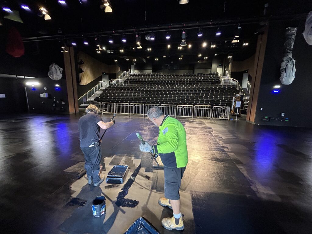 St Catherines School Stage being painted with JuJu Blitz Total Black